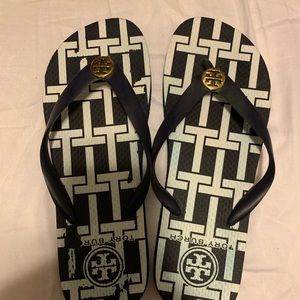 Tory Burch navy and white flip flops. Never worn.
